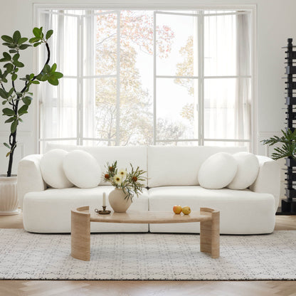 Grace two-seat modular white sofa with round cushions in a bright, airy living space - CHITA Living