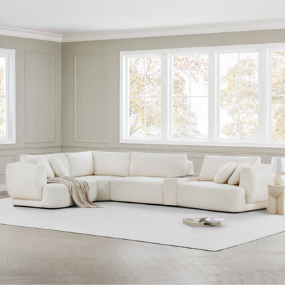 Light Grace curved modular sofa with cozy cushions in bright, elegant living space - CHITA Living