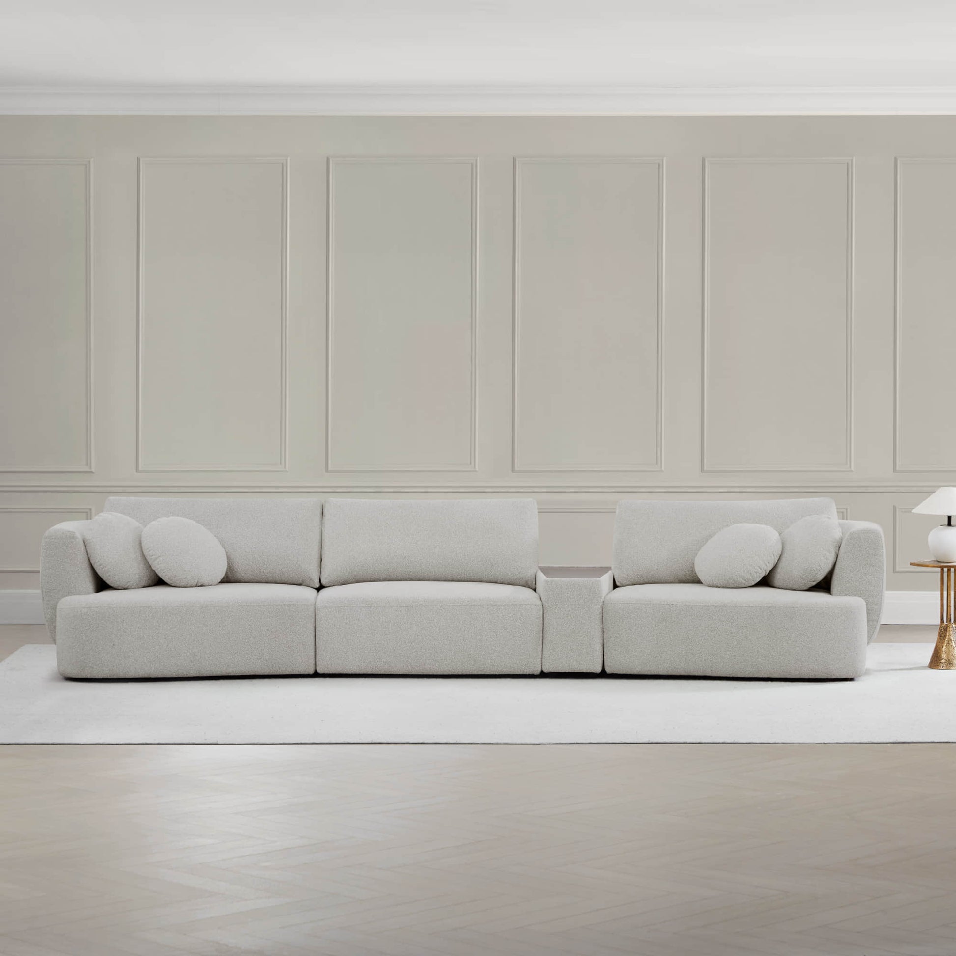 Grace 3-Seat Modular Curved Sofa in light fabric with round cushions in modern setting.