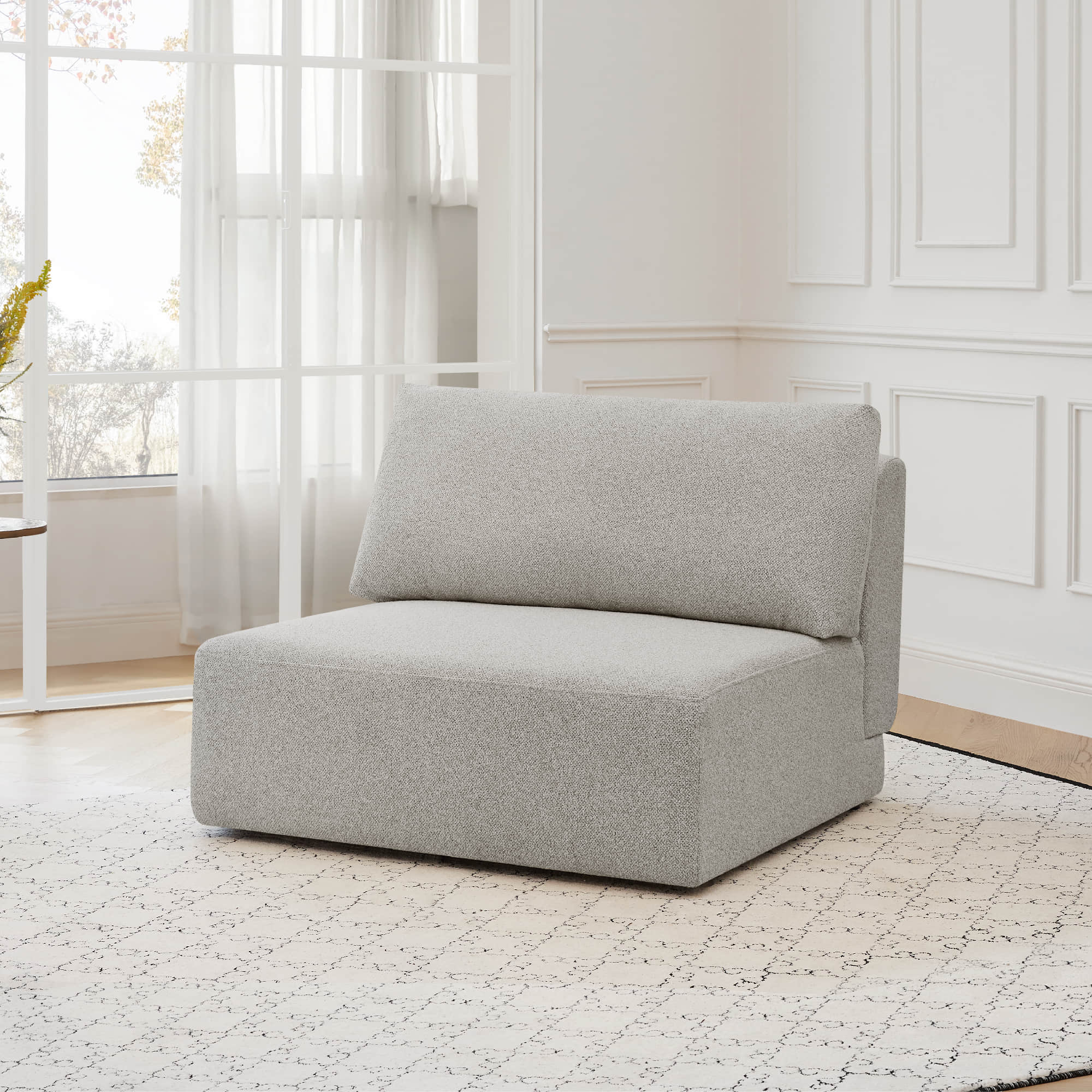 Cozy Grace modular armless sofa chair with boucle fabric in a stylish living space - CHITA Living