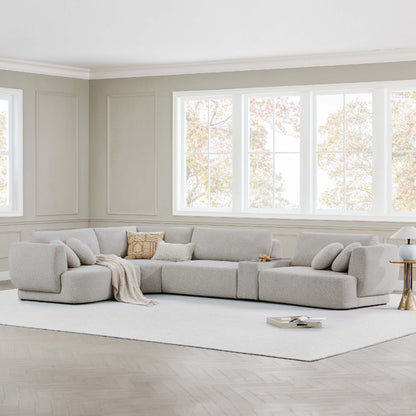 Grace modular curved sofa in light boucle fabric in a bright, modern living room - CHITA Living