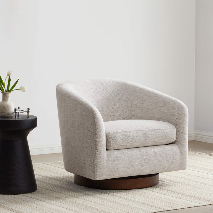 Beige swivel accent chair on a patterned rug next to a sleek black side table - CHITA Living