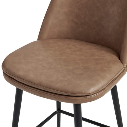 Close-up of Eli swivel bar stool with brown faux leather seat and black metal frame - CHITA Living