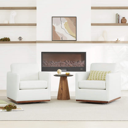 Two white Henry Modern Swivel Accent Chairs with wooden bases in a stylish living room setting - CHITA Living