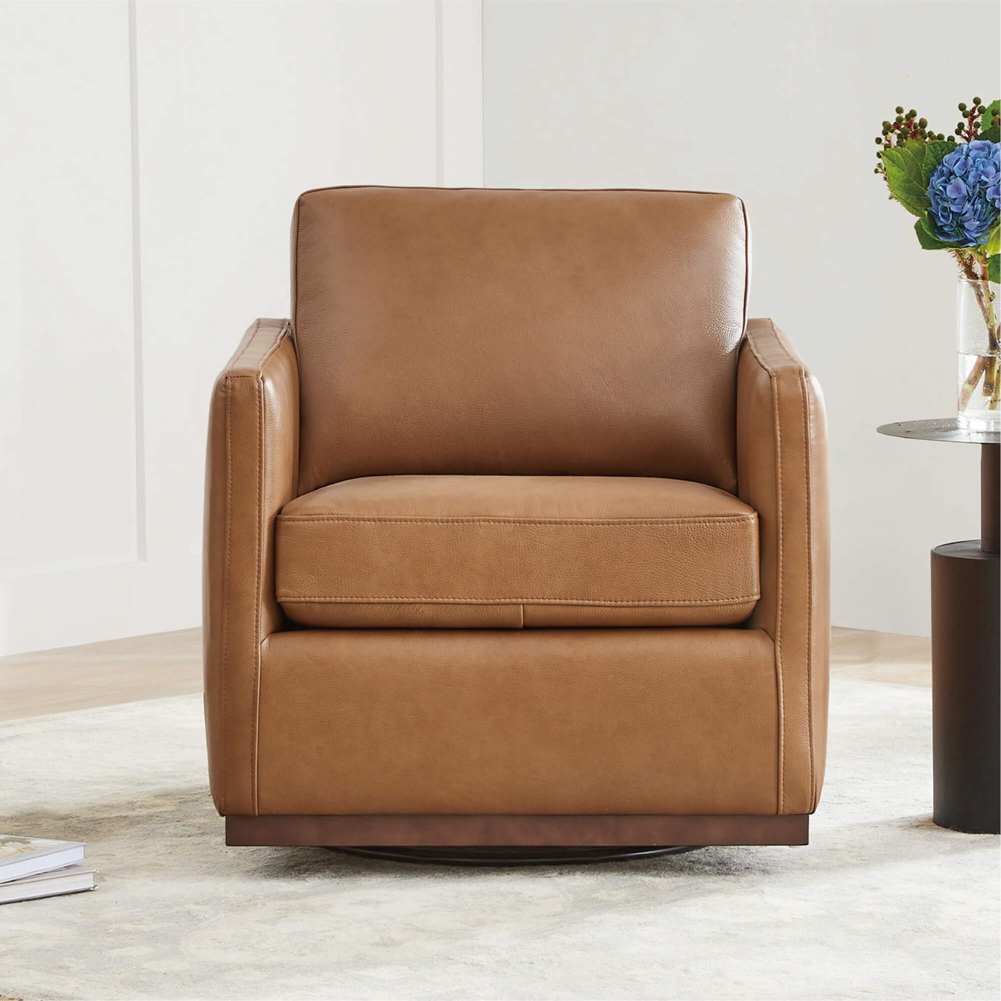 Brown leather Henry Modern Swivel Accent Chair with wooden base in stylish setting - CHITA Living