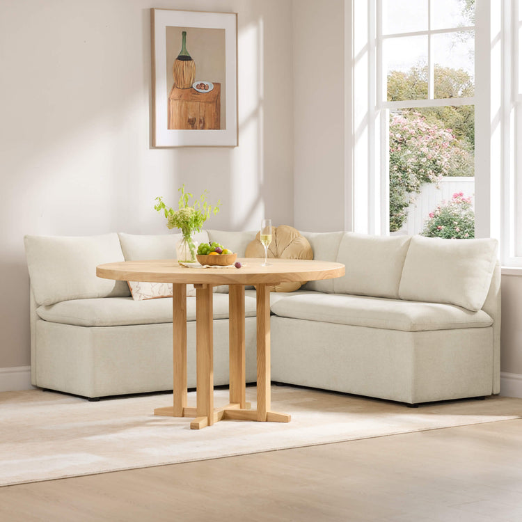 Lila 5-seat dining banquette with storage in beige, paired with a round wooden table.