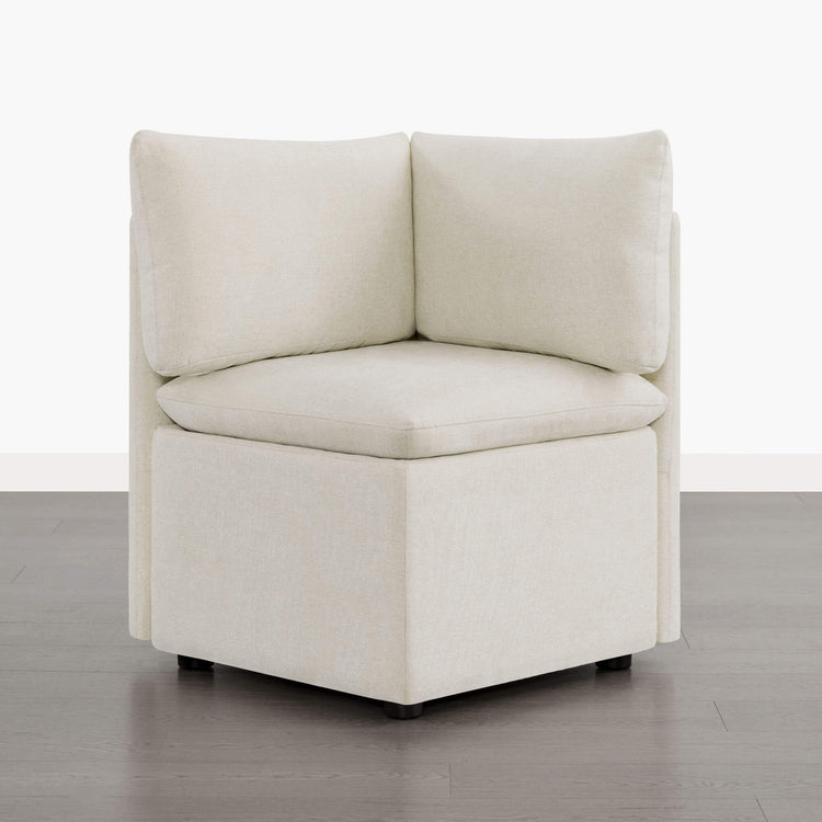 Lila minimalist corner seat in light beige fabric with plush cushions and hidden storage.