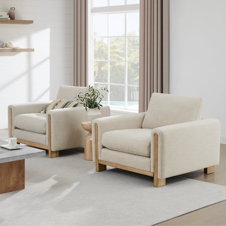 Modern Keaton Armchairs with natural wood base and plush cushions in a sunny room - CHITA Living