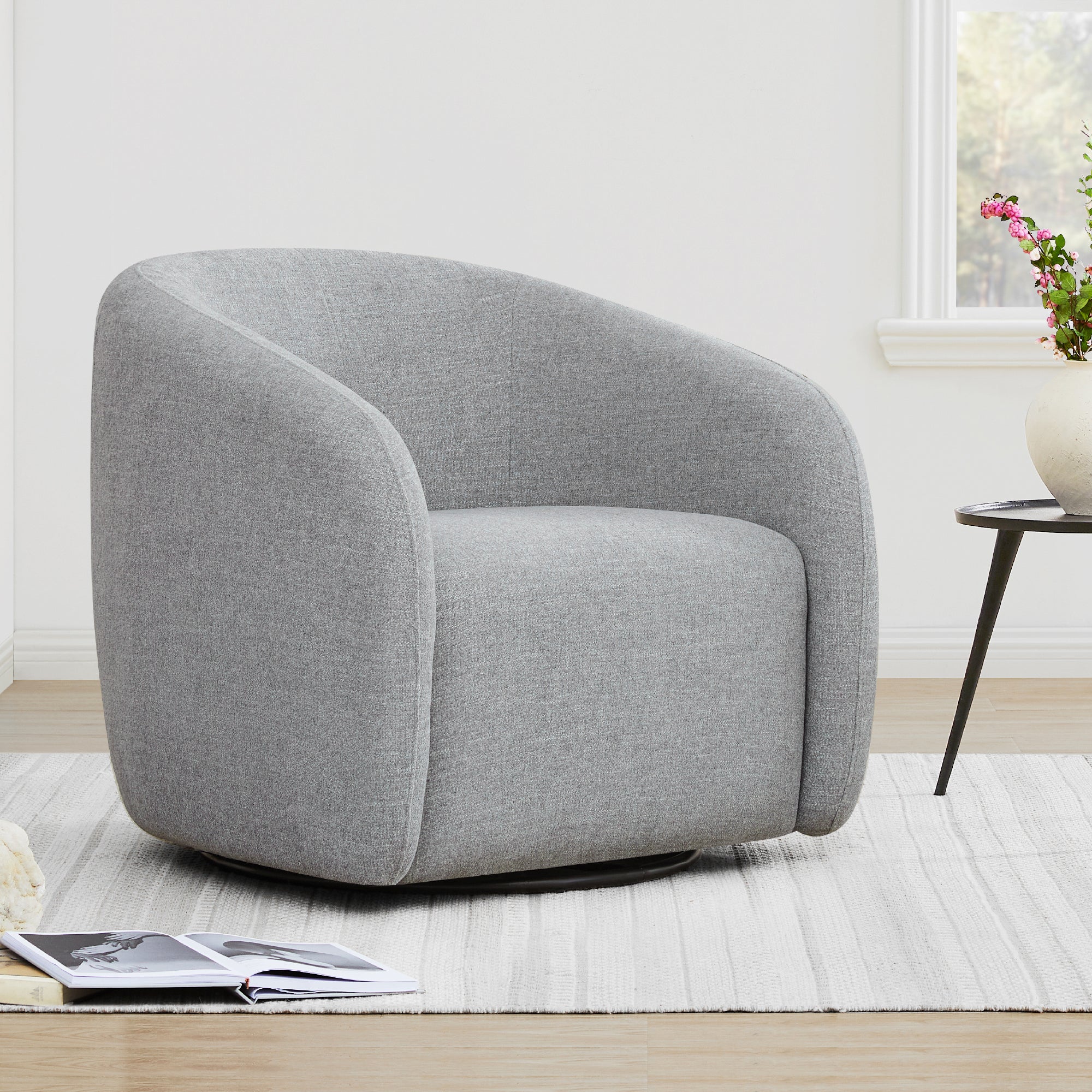 Light gray swivel accent chair with curved back and plush seating - CHITA Living