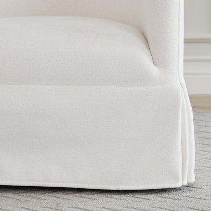 Close-up of EllaGrace swivel armchair with clean kick-pleat corners in soft white - CHITA Living