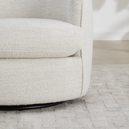 Cream textured Luke Modern Swivel Accent Chair showcasing soft curves and plush upholstery - CHITA Living