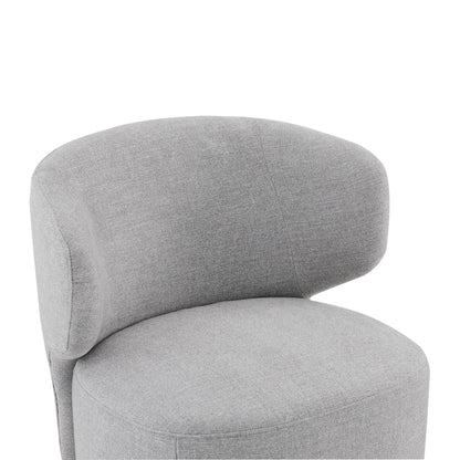 Close-up of Skylar swivel accent chair in soft grey fabric with curved backrest - CHITA Living