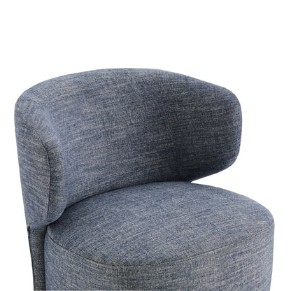 Close-up of Skylar swivel accent chair in dark denim fabric with plush curved back - CHITA Living