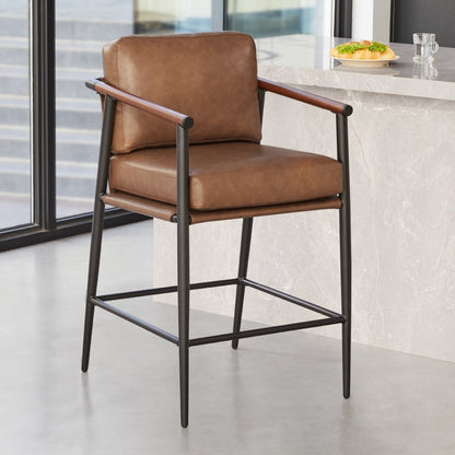 Charlotte Modern Counter Stool with brown leather and wooden armrests in a bright kitchen - CHITA Living