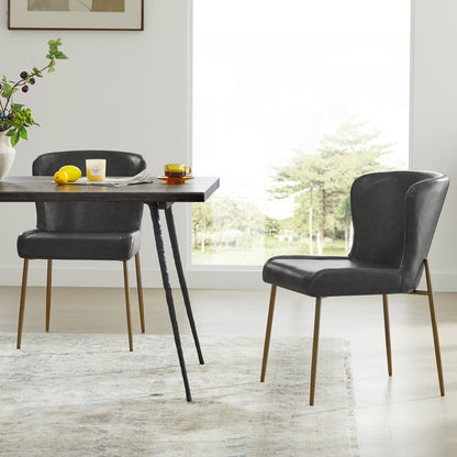 Golda Dining Chairs in grey faux leather with brass legs in a bright dining area - CHITA Living