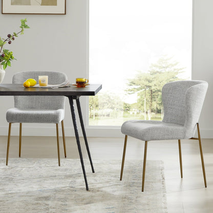 Golda Dining Chairs with grey upholstery in a bright dining room setting - CHITA Living