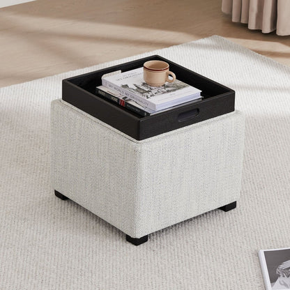 Stylish cube storage ottoman with tray, books, and coffee cup in modern living room setup - CHITA Living