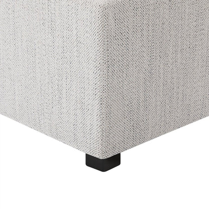 Close-up of light fabric cube storage ottoman showcasing stitching and corner design - CHITA Living