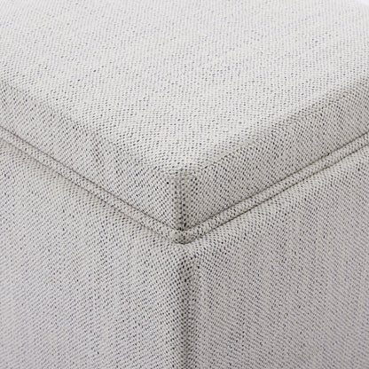 Close-up of light fabric cube storage ottoman highlighting texture and stitching details - CHITA Living