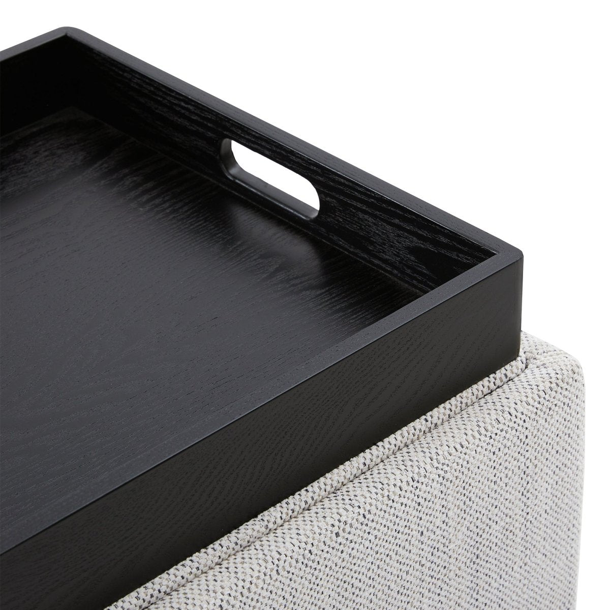 Close-up of light fabric cube storage ottoman with removable black tray - CHITA Living