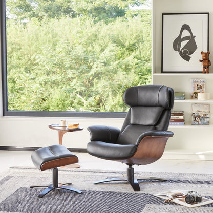 Black Elvin leather recliner and ottoman set in chic modern living space with greenery view - CHITA Living