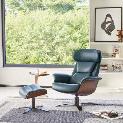 Teal leather Elvin recliner and ottoman in bright living room with greenery view - CHITA Living