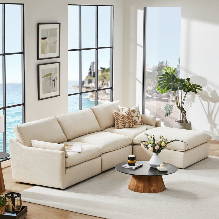 Kenna Modular Sofa-Chaise sectional in cream, modern living room, comfortable seating with ocean view.